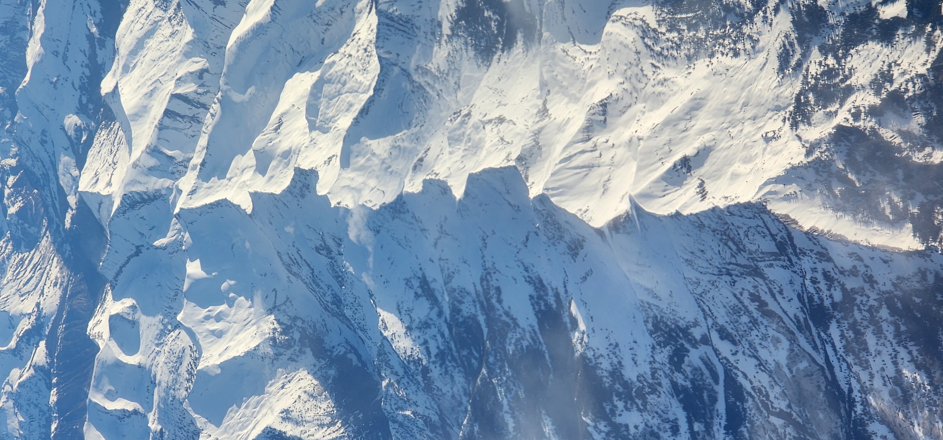 Mountain Range in Snow from airplane